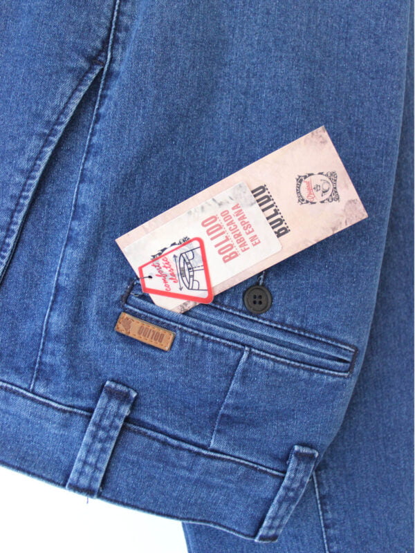 a pair of tickets in a pocket of a blue jean